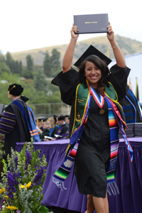 Graduating senior Emily Baeza crosses the stage at Commencement.