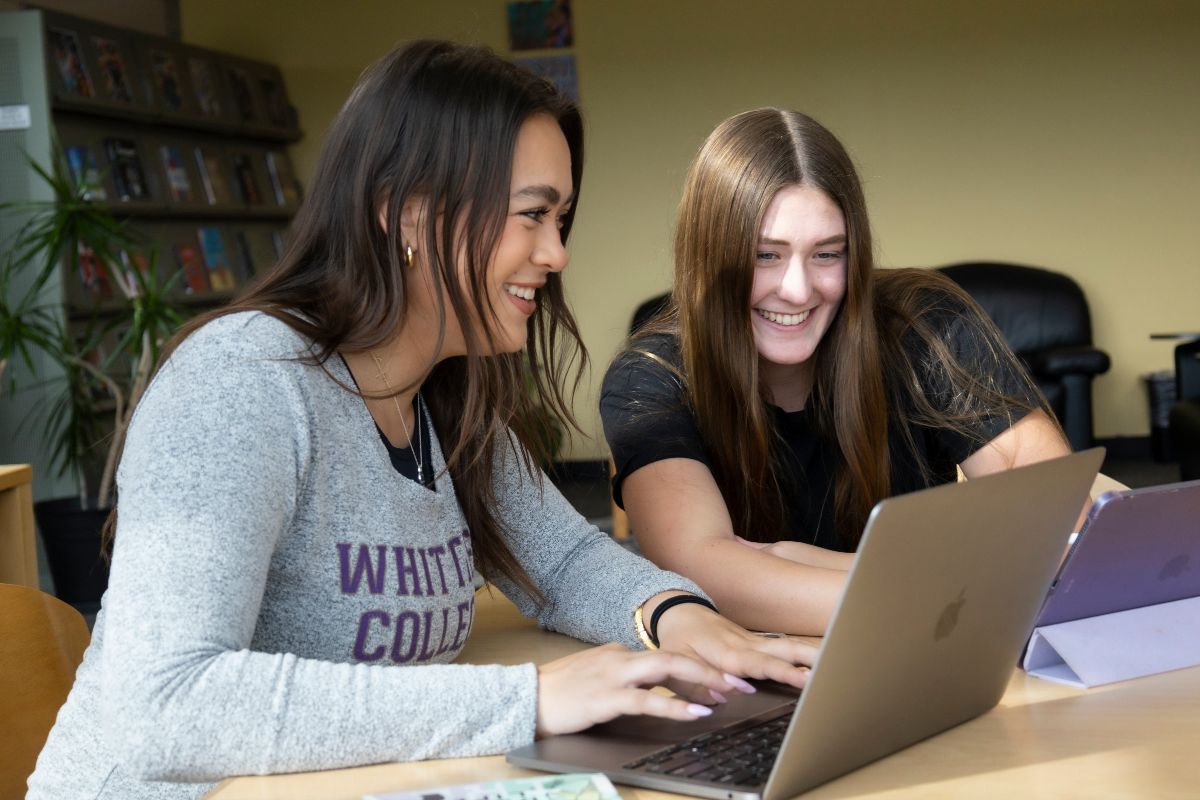 Two students at a laptop