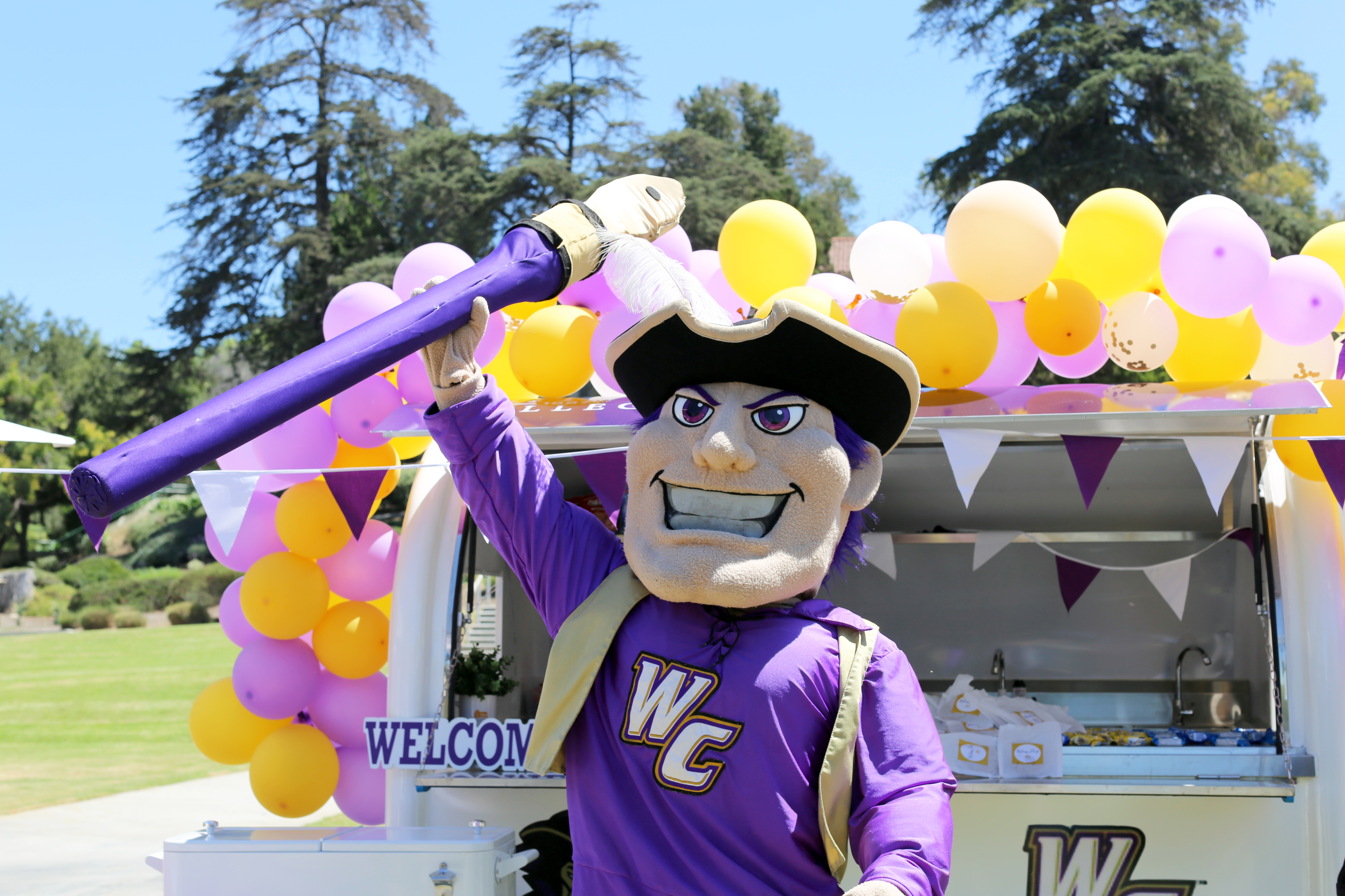 Johnny Poet stands at the Poet MoWheel on the first day of class, Aug. 21, 2024 | Whittier College