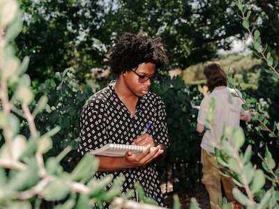 Whittier student in the coffee orchard