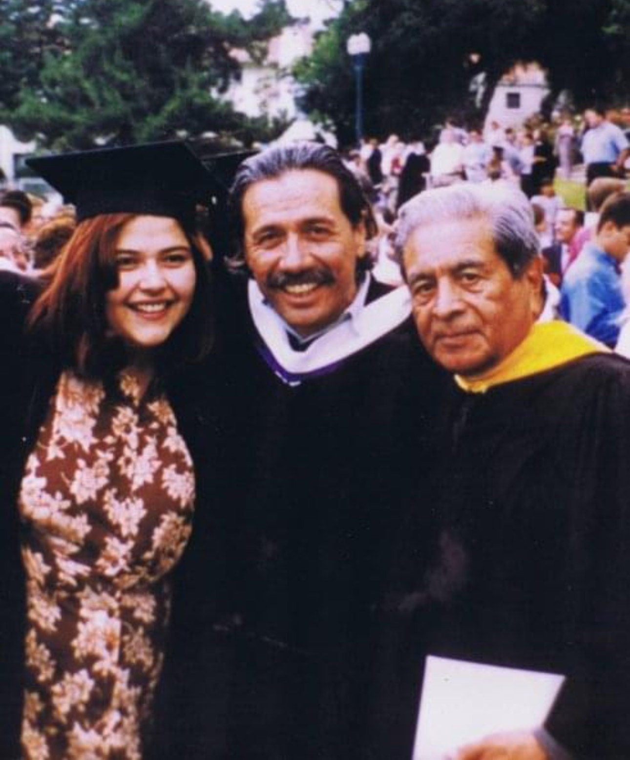 Perla Hernandez Trumkul '96, from left, actor and keynote speaker Edward James Olmos, and Martin Ortiz ’48 pose at Whittier College Commencement. | Courtesy Perla Hernandez Trumkul