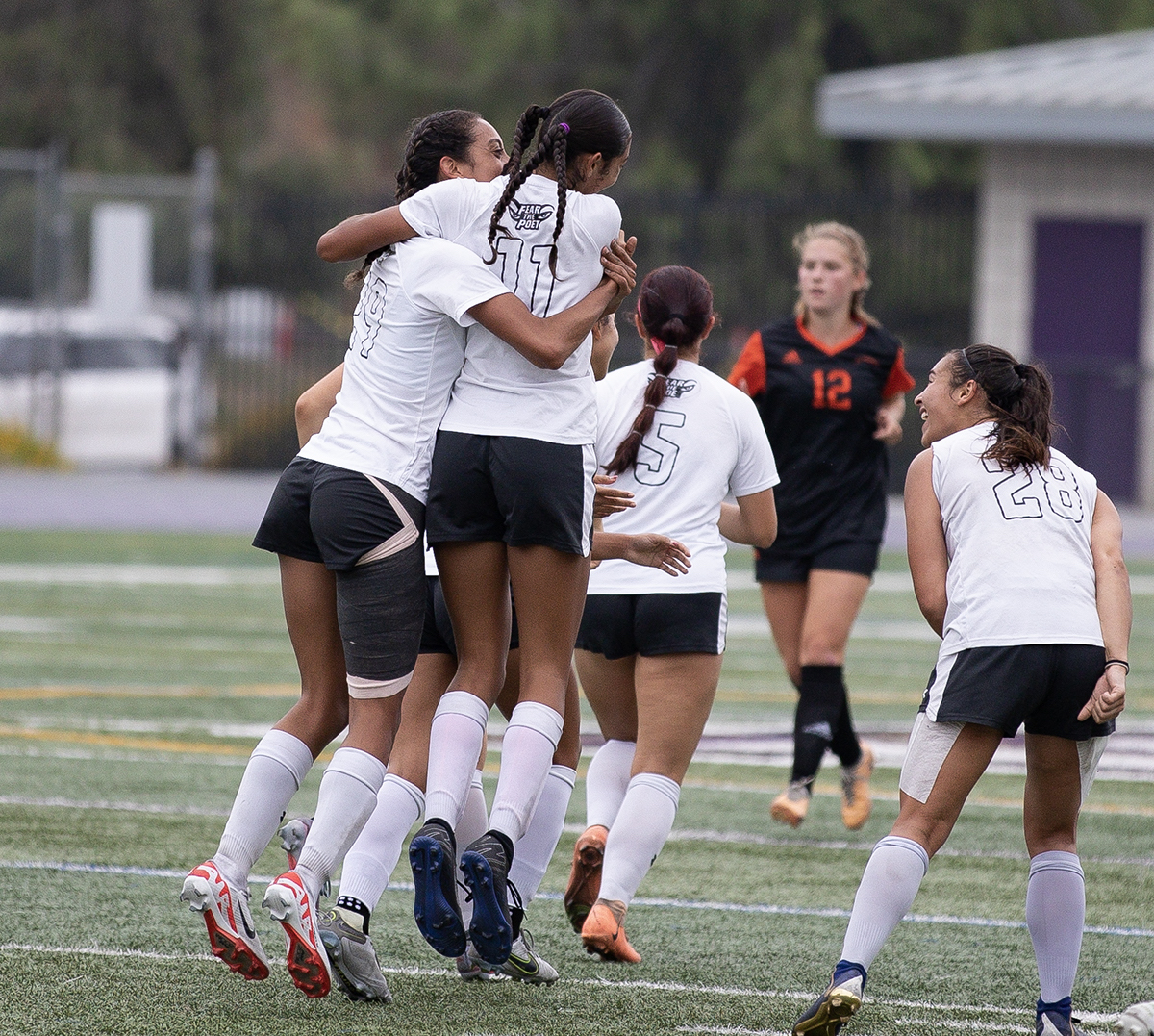 Sisters Layla and Madeline ​​Traylor Embrace During a Whittier Poets Soccer Game