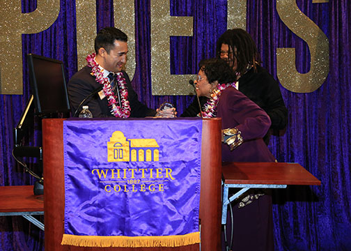 Dr. Thelma Eaton receiving an award from Robert Allarte and Andrea 