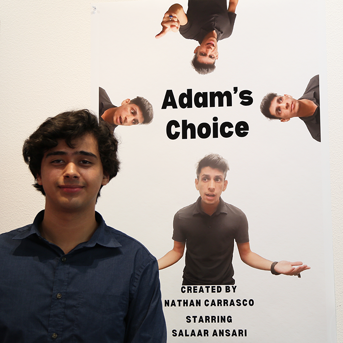 Nathan Carrasco in front of movie poster