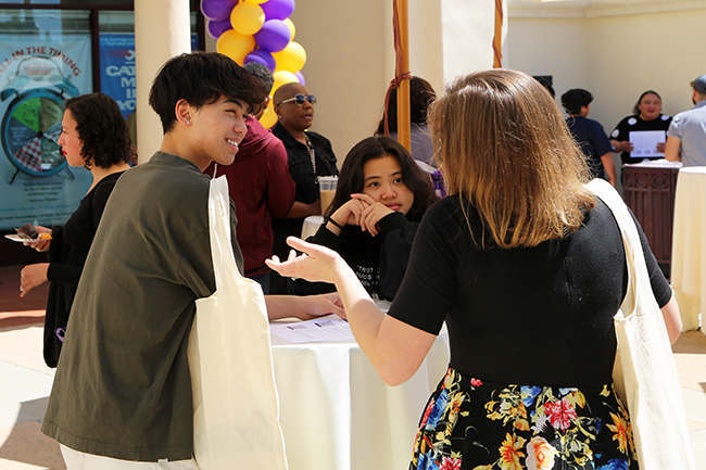 Admission staff talking to a student
