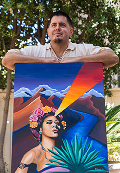 photo of artist Elias Vargas with artswork