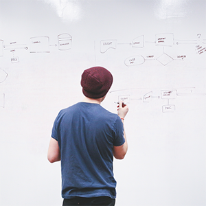 Student working at a white board.