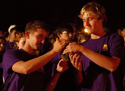 Hundreds of new poets light candles in honor of "the light of knowledge" at the 2010 convocation.