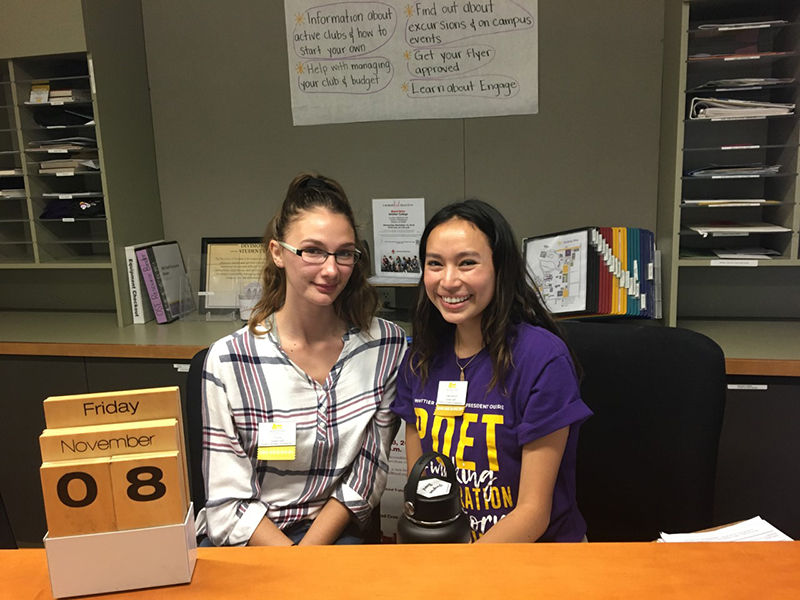 Genesis and another student behind a desk