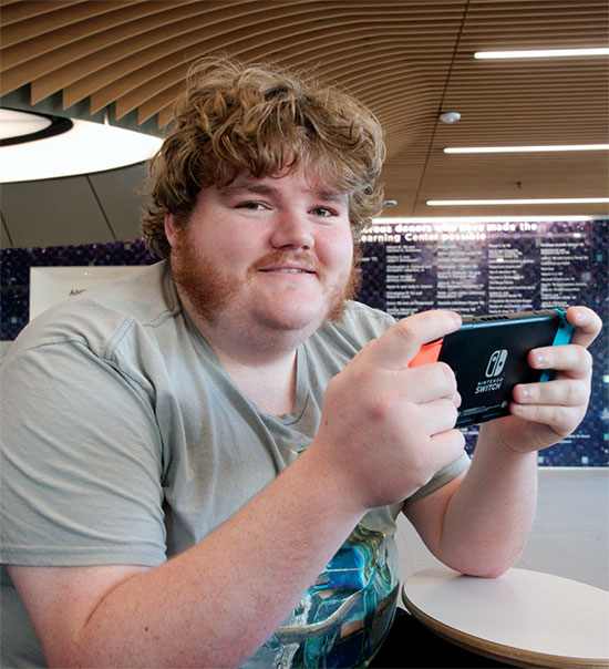 Charlie Craft plays a Nintendo Switch.