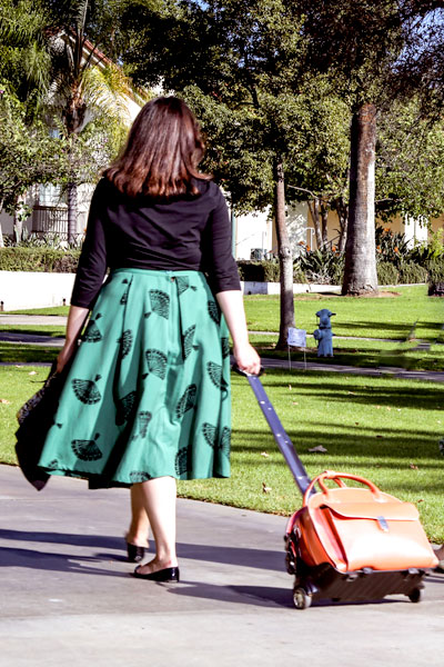 Female student rolls briefcase