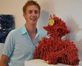 Jeff Edwards '10 stands by his sculpture which recieved 1st place at the greenleaf gallery 