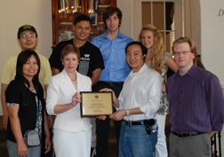 College President Sharon  Herzberger  stands with Whittier College professor Jake Carbine at the Citzens of Burma Award.