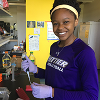 Chemistry major Olive Anagu in a lab.