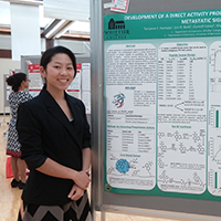 Chemistry major Terianne Hamada stands by a scientific poster.