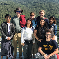 Students and professors pose for a photograph in Myanmar during an environmental trip.