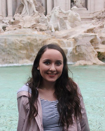 McKenna in front of a fountain in Rome.