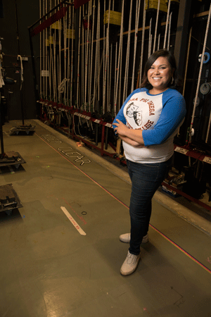 Student Jocelyn Lopez stands back stage