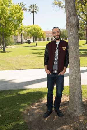 Amer Rashid stands on campus