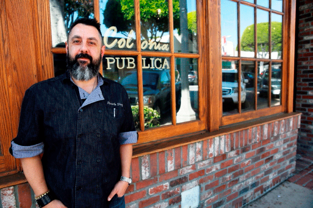 Ricardo Diaz stands in front of restaurant