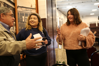 Students speaking to a community member