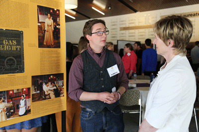 Student in front of poster board