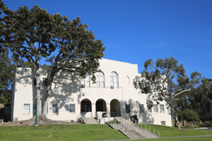 Photo of the front of Wardman Gym with green lawn in the front