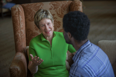 President Herzberger talking to a student