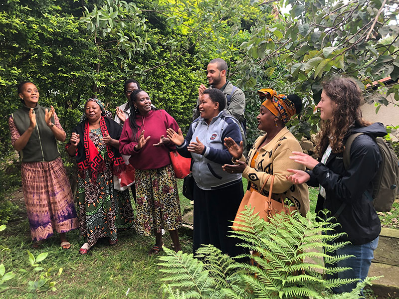 Students with a women's group in Bangata Ward.