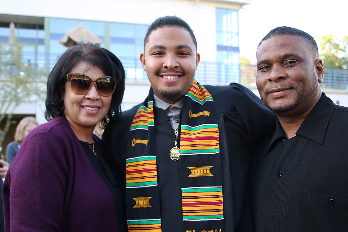 Black graduate and family.