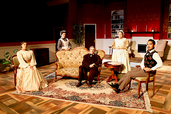 Five student actors pose for a photograph on the set of "Gaslight."