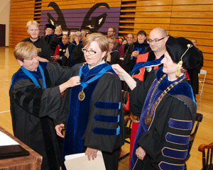 Kathy Barlow receiving the Nerhood Award from Joyce Kaufman