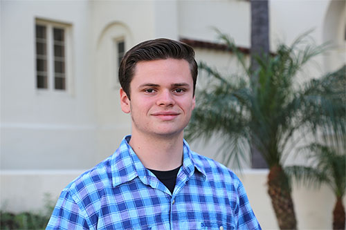 Luke Holbert in front of Mendenhall.