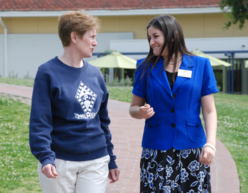 President Herzberger dawns her Palmer sweatshirt as senior Tina Rinaldi  sports a suit. The two switched places for the day. 