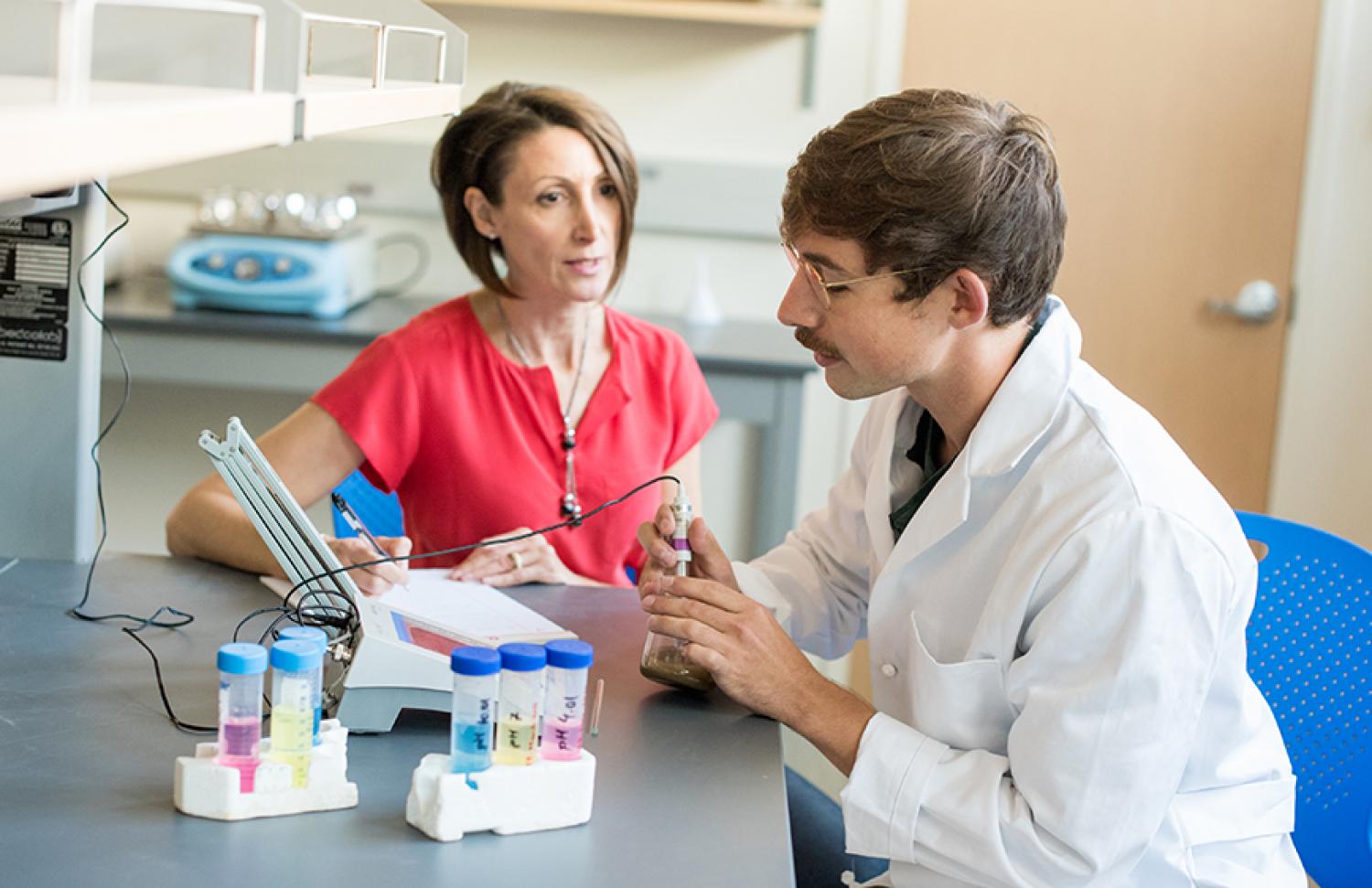 Professor and student in a lab
