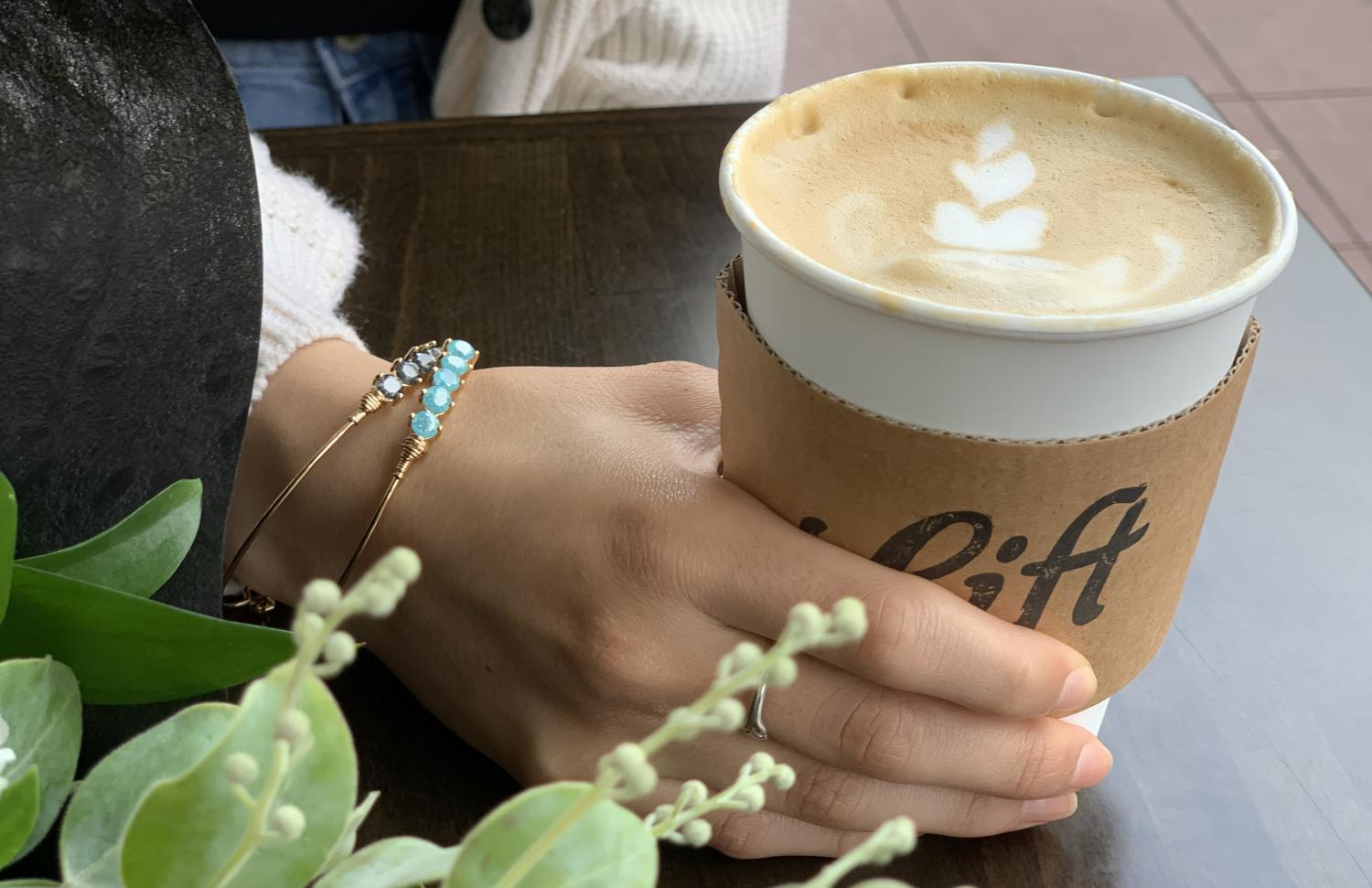 Coffee cup and flowers