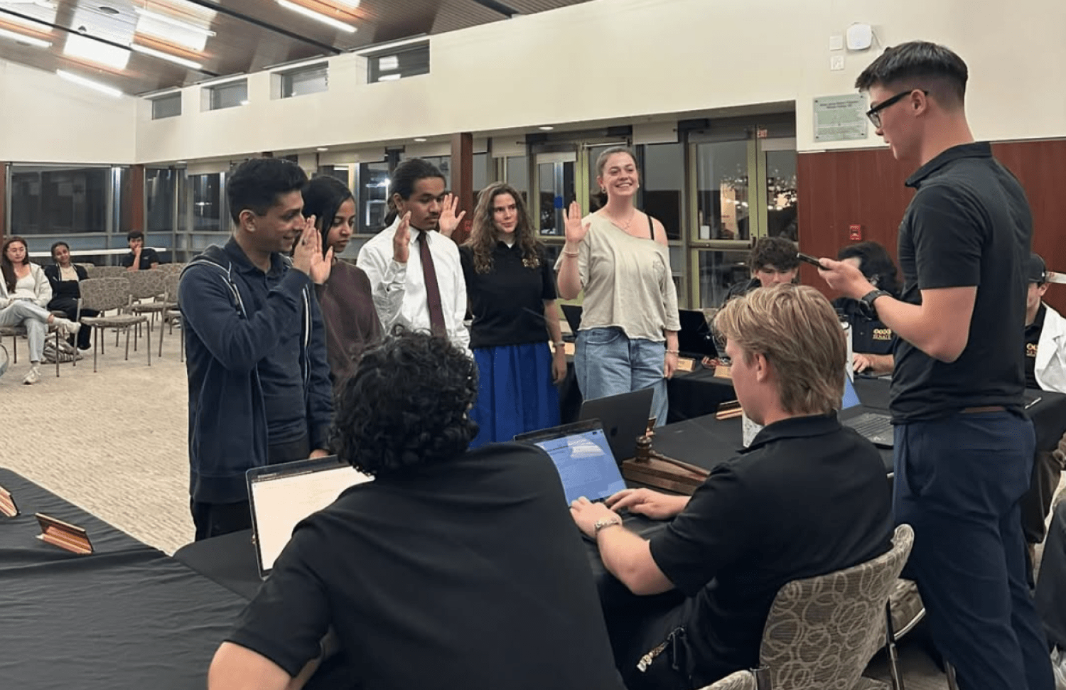 Student leaders taking an oath of office at Whittier College