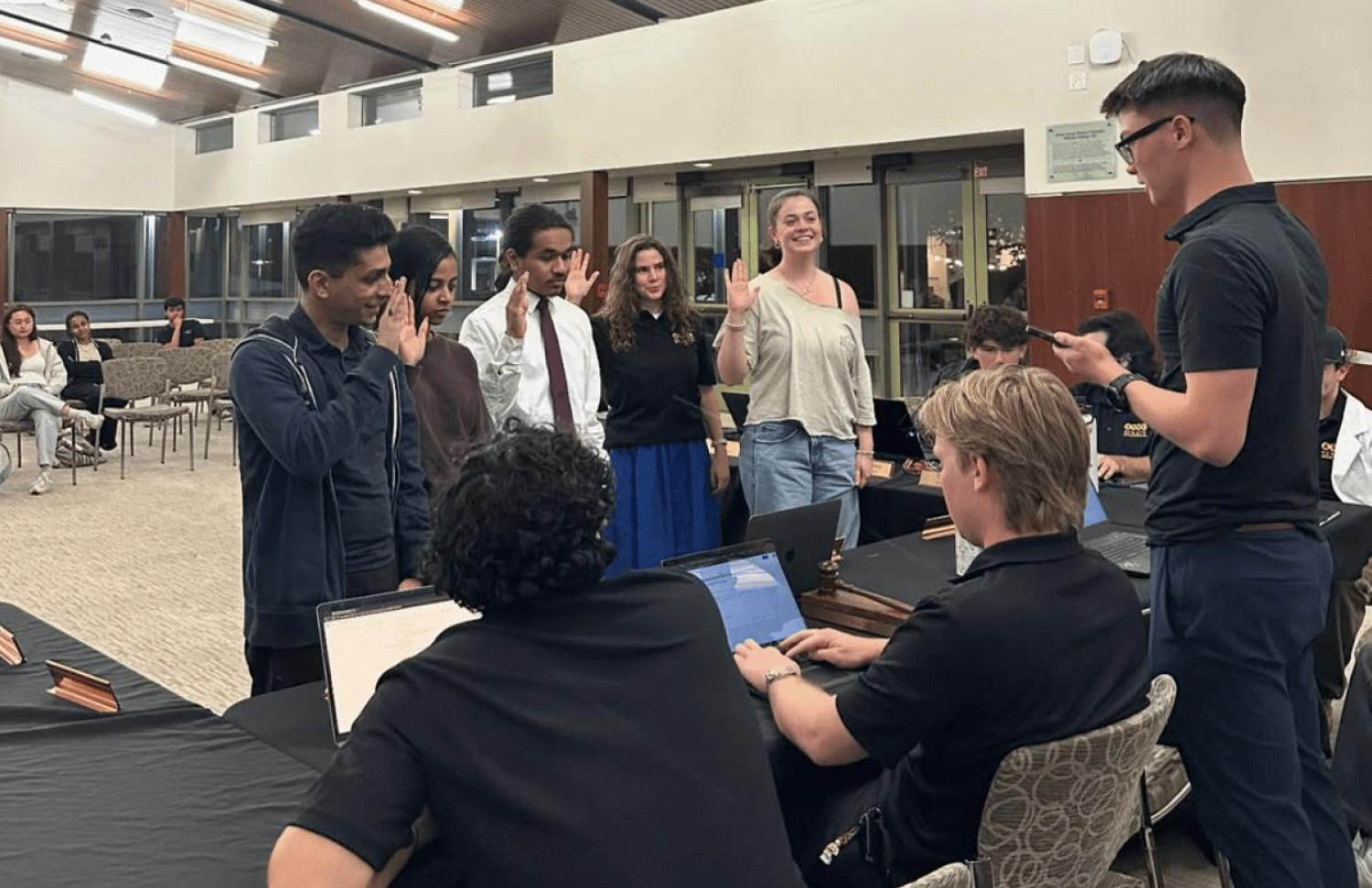 Student leaders taking an oath of office at Whittier College