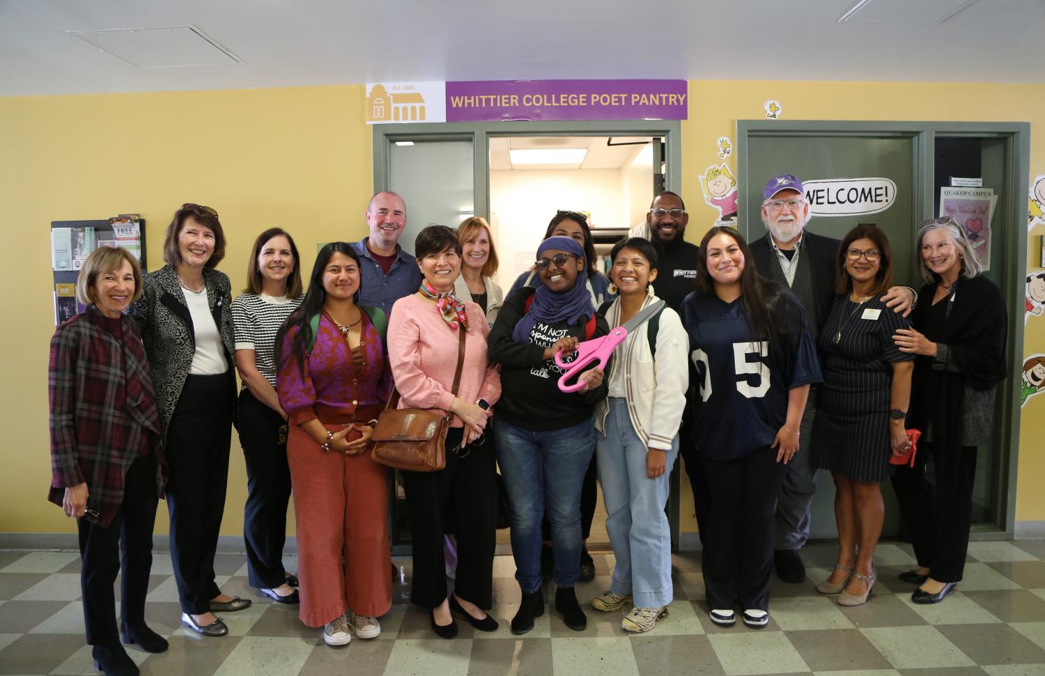 group of students, staff and faculty standing in front of poet pantry