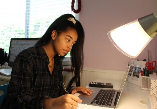 Nicole Collins at her desk