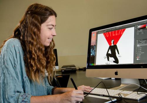Lauren Swintek doing graphic design