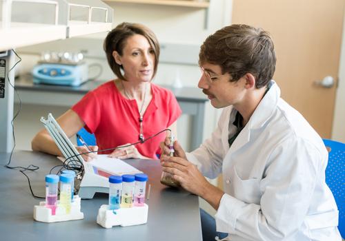 Professor and student in a lab