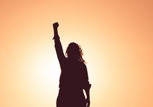 Woman raising arm