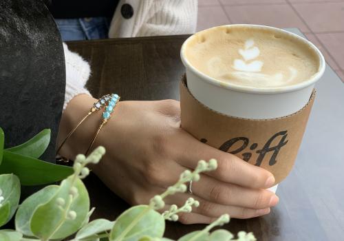 Coffee cup and flowers