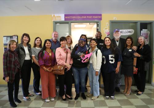 group of students, staff and faculty standing in front of poet pantry