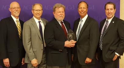 Members of the board of trustees holding an award