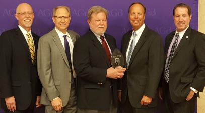 Members of the board of trustees holding an award