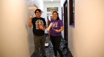 volunteers painting a wall