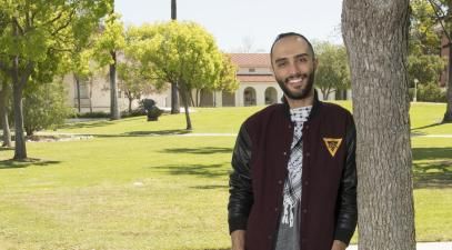 Amer Rashid stands on campus