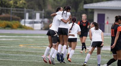 Sisters Layla and Madeline ​​Traylor Embrace During a Whittier Poets Soccer Game
